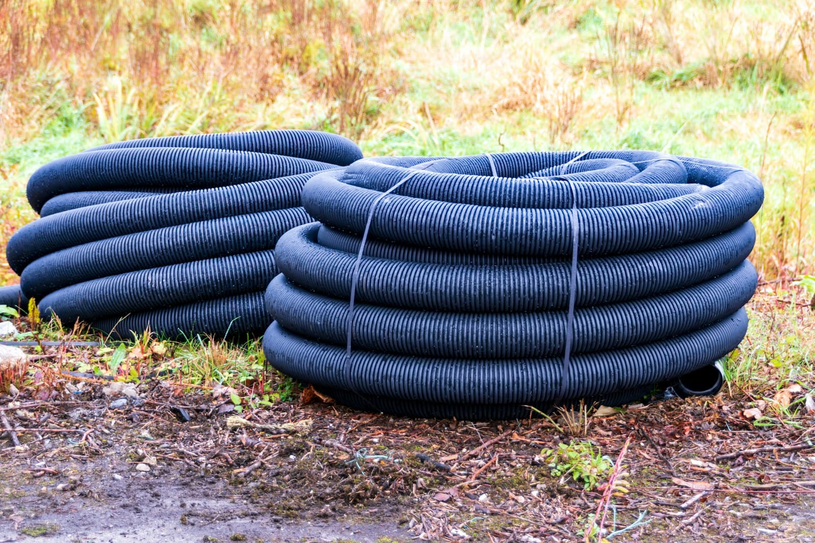Coils of perforated drainage pipe